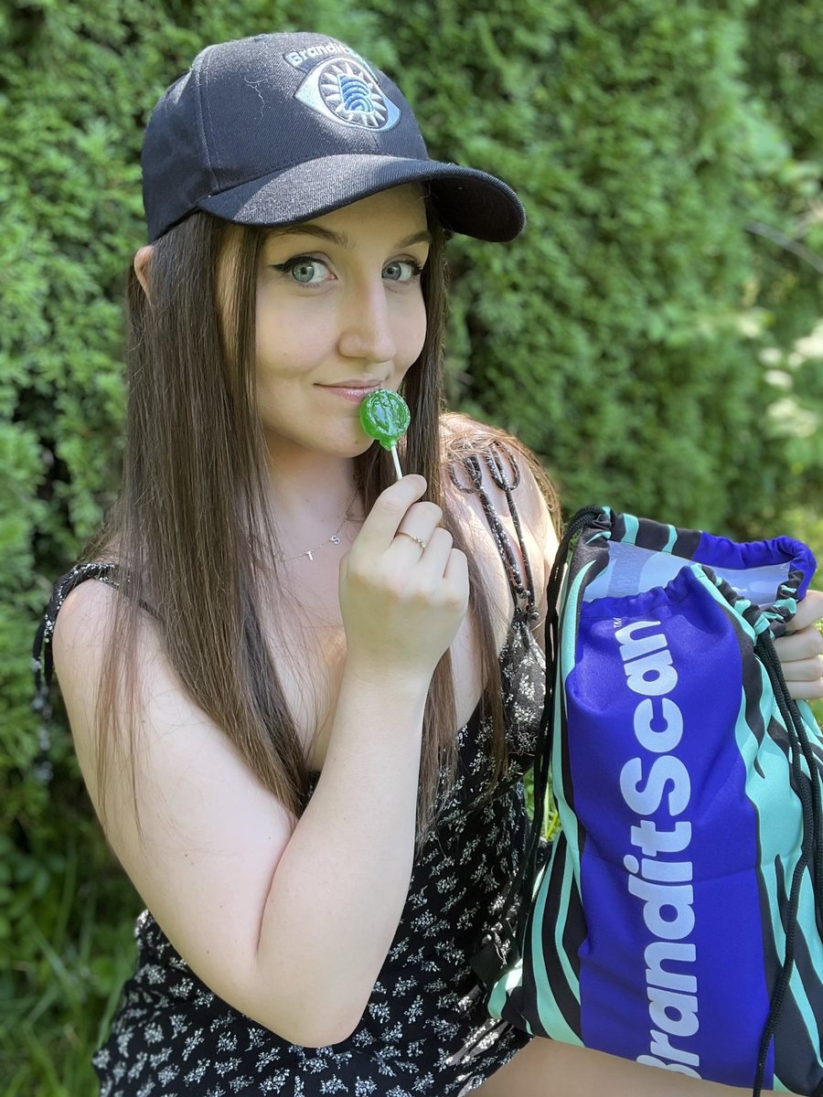 ElleSquishy in a BranditScan cap with merch